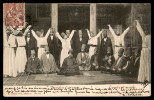 לוט 167 – גלויה עותמאנית – דרווישים מסתובבים, קונסטנטינופול, בול דואר צרפתי לבנט | Lot 167 – Ottoman Postcard – Whirling Dervishes, Constantinople, French Levant Stamp